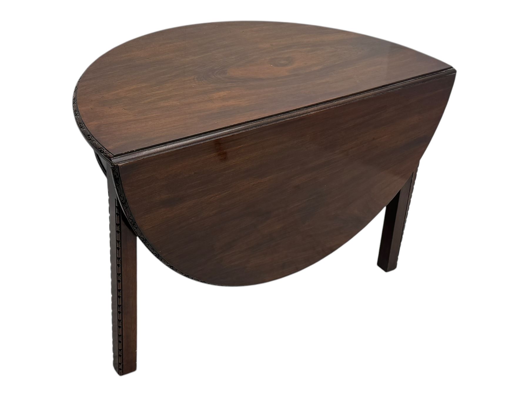 Early 20th century mahogany demi-lune table, the circular top with carved foliate border, raised on square section supports with relief carved edges