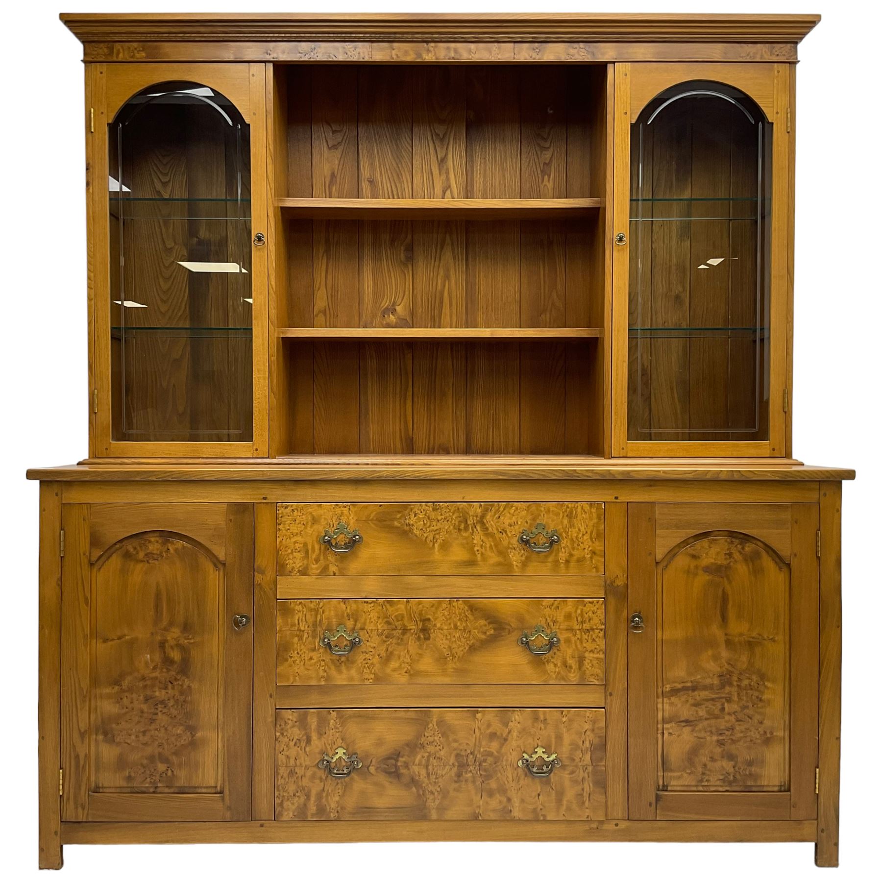 David Shackleton of Snainton - highly figured elm dresser, projecting moulded cornice over raised display cabinets and shelves, the base fitted with three central drawers and flanked by panelled cupboards, inscribed 'DS 1990'