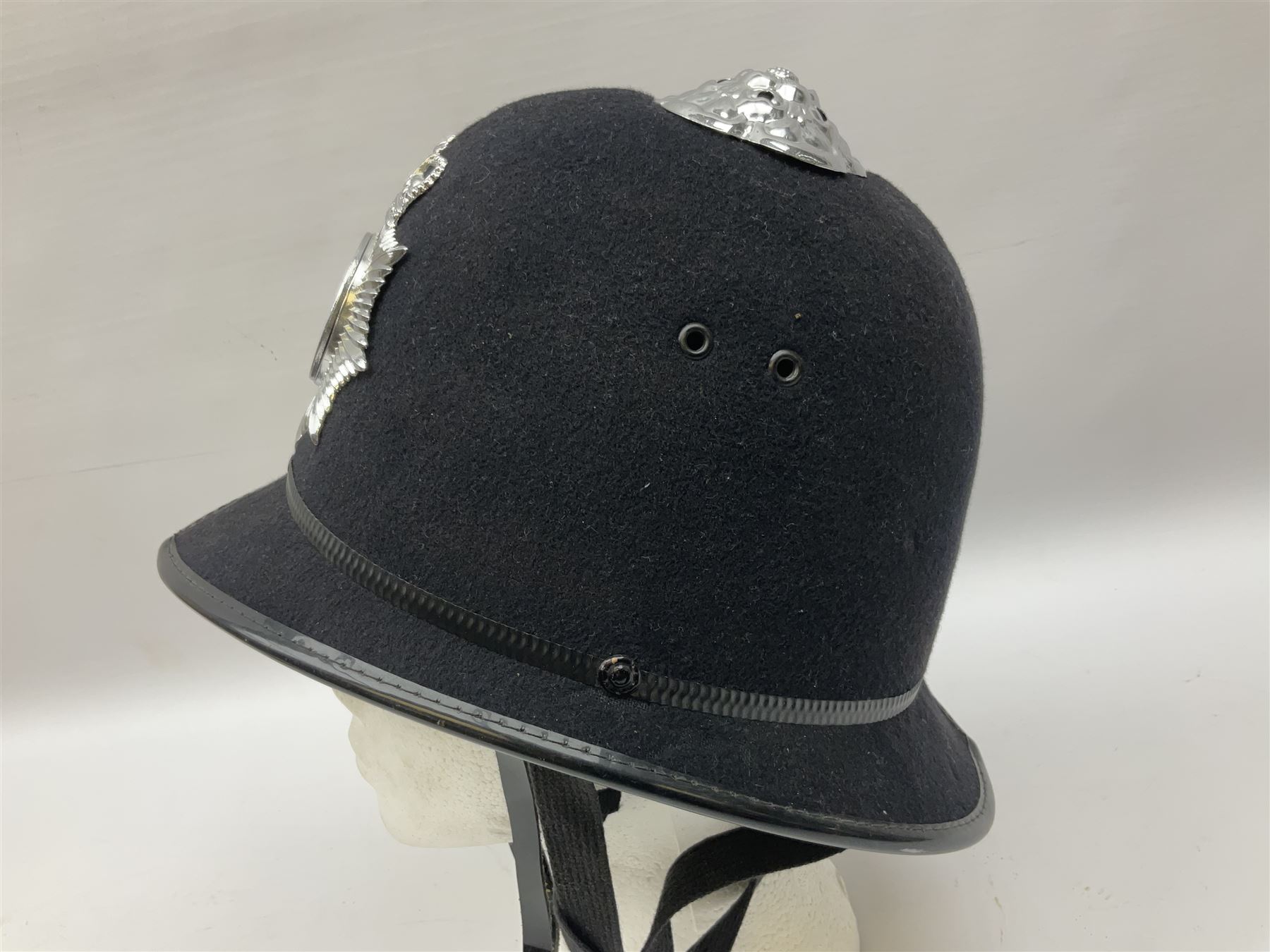 British Transport Police Custodian helmet with Queen's Crown plate; Hiatt & Co ebonised hardwood patrol truncheon; and pair of Hiatts 1960 hand-cuffs (3)