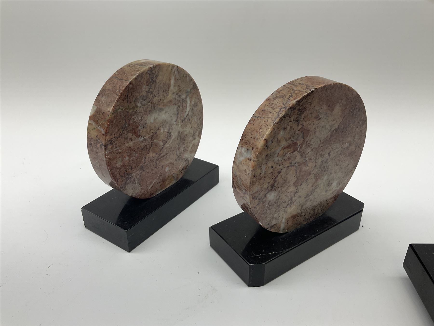 Art Deco style marble and anodised spelter three-piece clock garniture, model with recumbent gazelle, centre piece L52cm.  