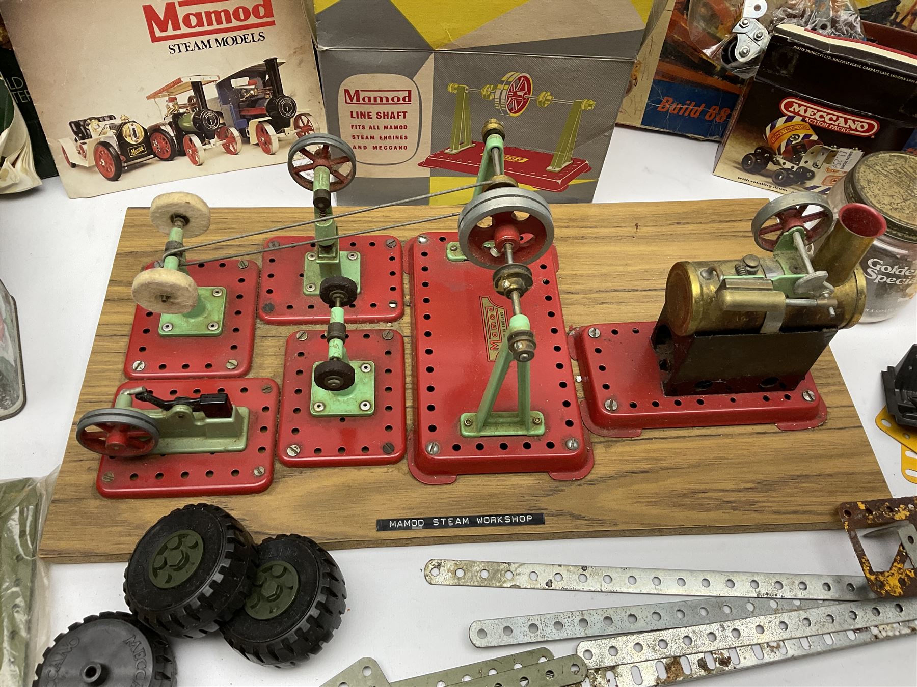 Mamod Minor 1 stationary live steam engine, line shaft, power hammer etc, attached to a wood board, with boxes and a quantity of Meccano 
