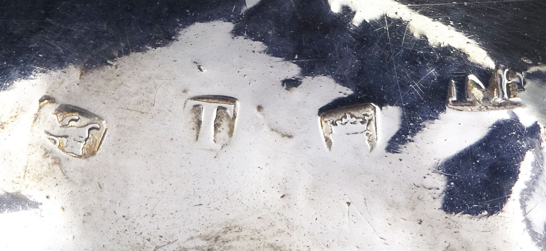 Georgian toddy ladle with silver tapering oval bowl and later turned wooden handle, engraved with initials to underside of bowl, hallmarked London, probably 1734, maker's mark indistinct, H39cm, together with two Georgian toddy ladles with silver bowls and baleen twist handles, the first example with circular bowl marked CB, H35.5cm, the second example with oval bowl and spout, unmarked but testing as silver, H35.5cm