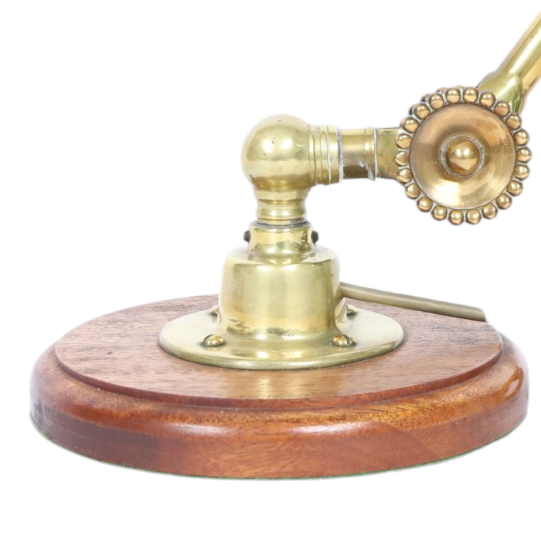 John Dugdill, early 20th century brass angle poise desk lamp, circa 1930's, with daisyhead joints and amber coloured lampshade, upon a circular wooden base 