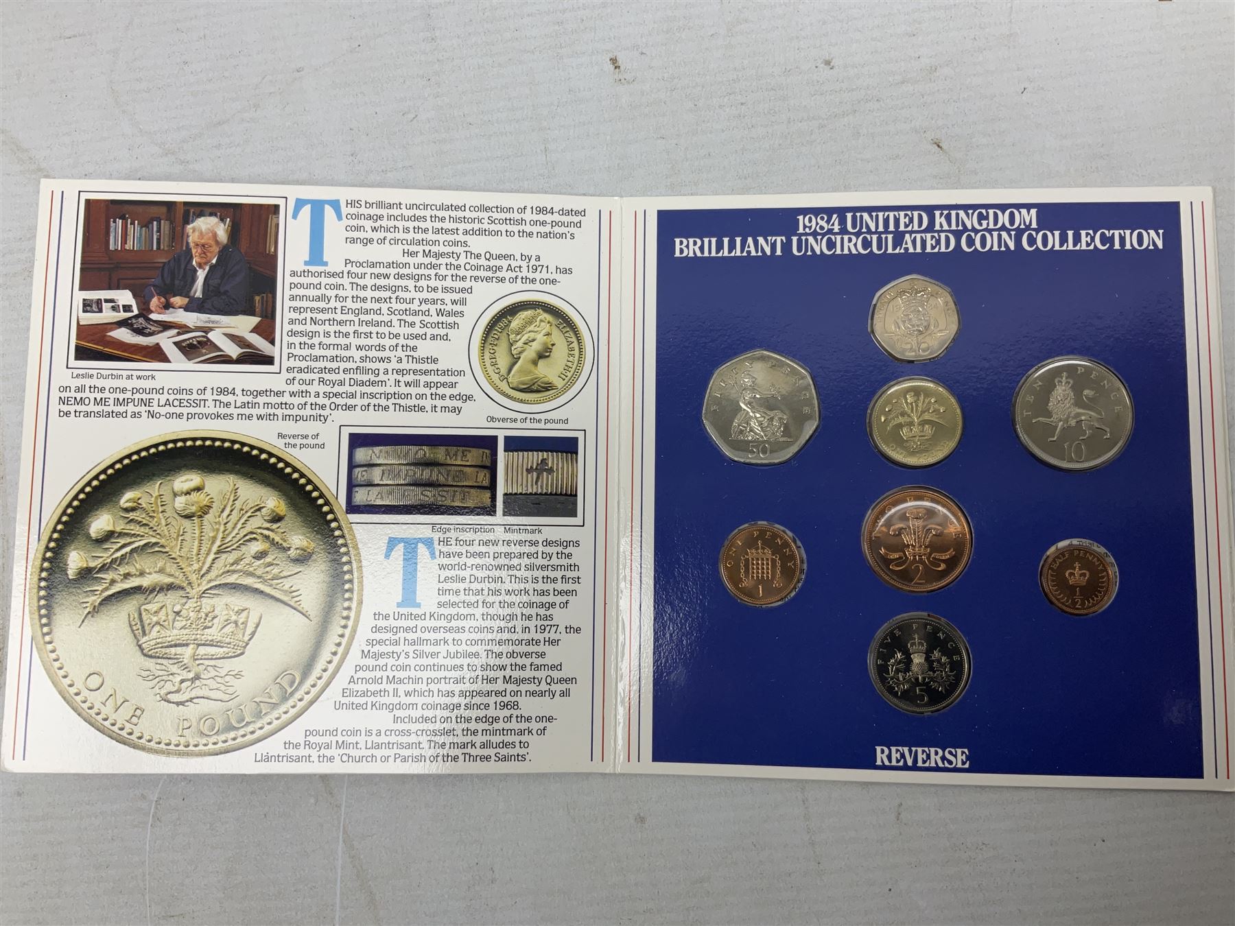 The Royal Mint United Kingdom 1984 brilliant uncirculated coin collection, 1997 and 2001 commemorative crown coins, 1997 old round one pound, all in card folders and four sterling silver medallic first day covers from the 'Great Britons' collection housed in a blue folder
