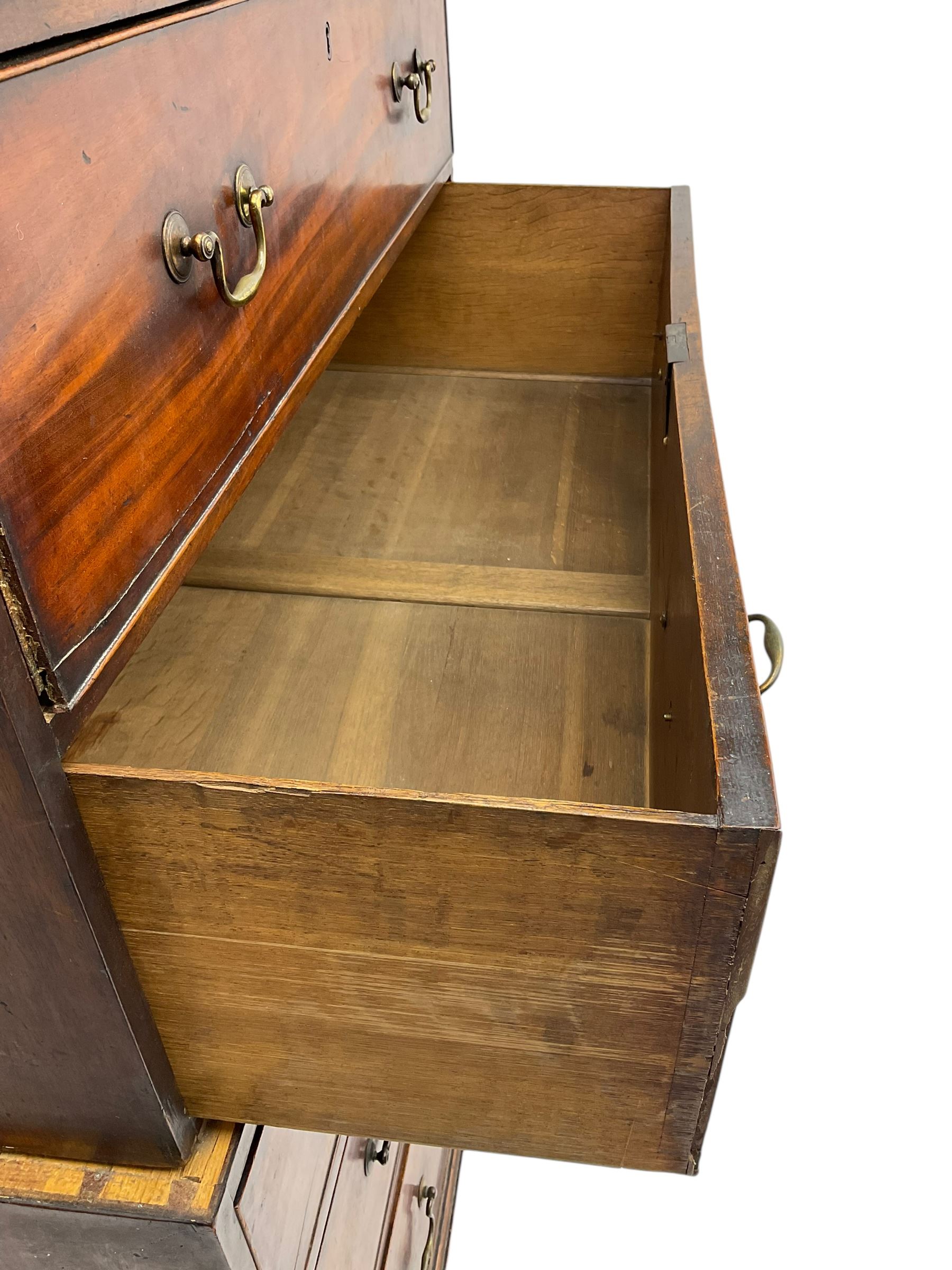 George III mahogany chest on chest, projecting cornice over plain frieze, fitted with two short and six long graduating cock-beaded drawers, on bracket feet