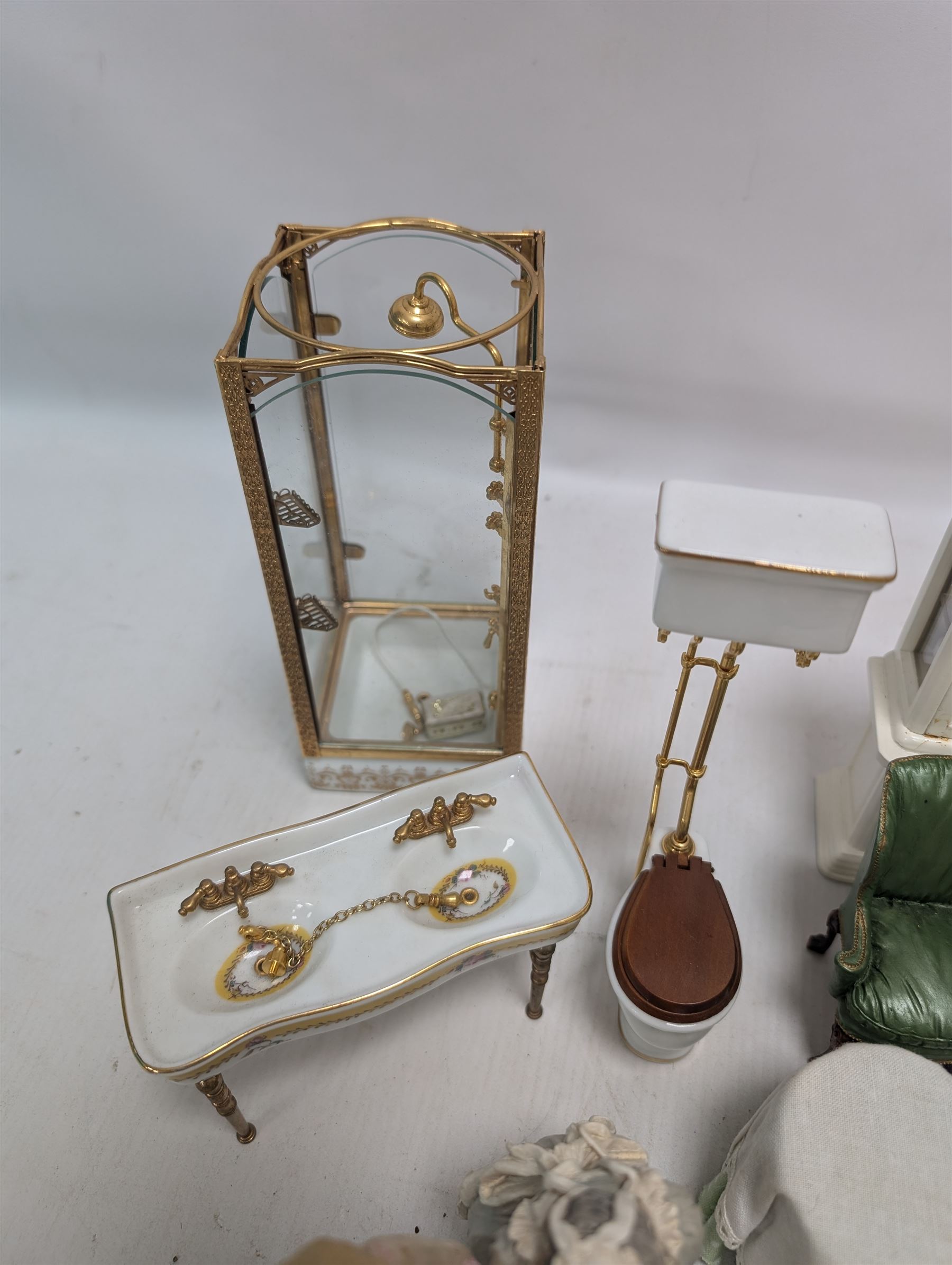 Dolls house bathroom and bedroom furniture, including bed, wardrobe, dresser filled with toiletries, shower, five figures, etc 