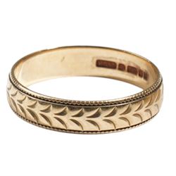 Two 9ct wedding bands, with engraved decoration