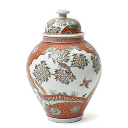 Japanese vase and cover decorated with panels of exotic birds in a fenced garden setting on orange and gilt scroll ground marked Zoshuntei Sanpo Zu H30cm