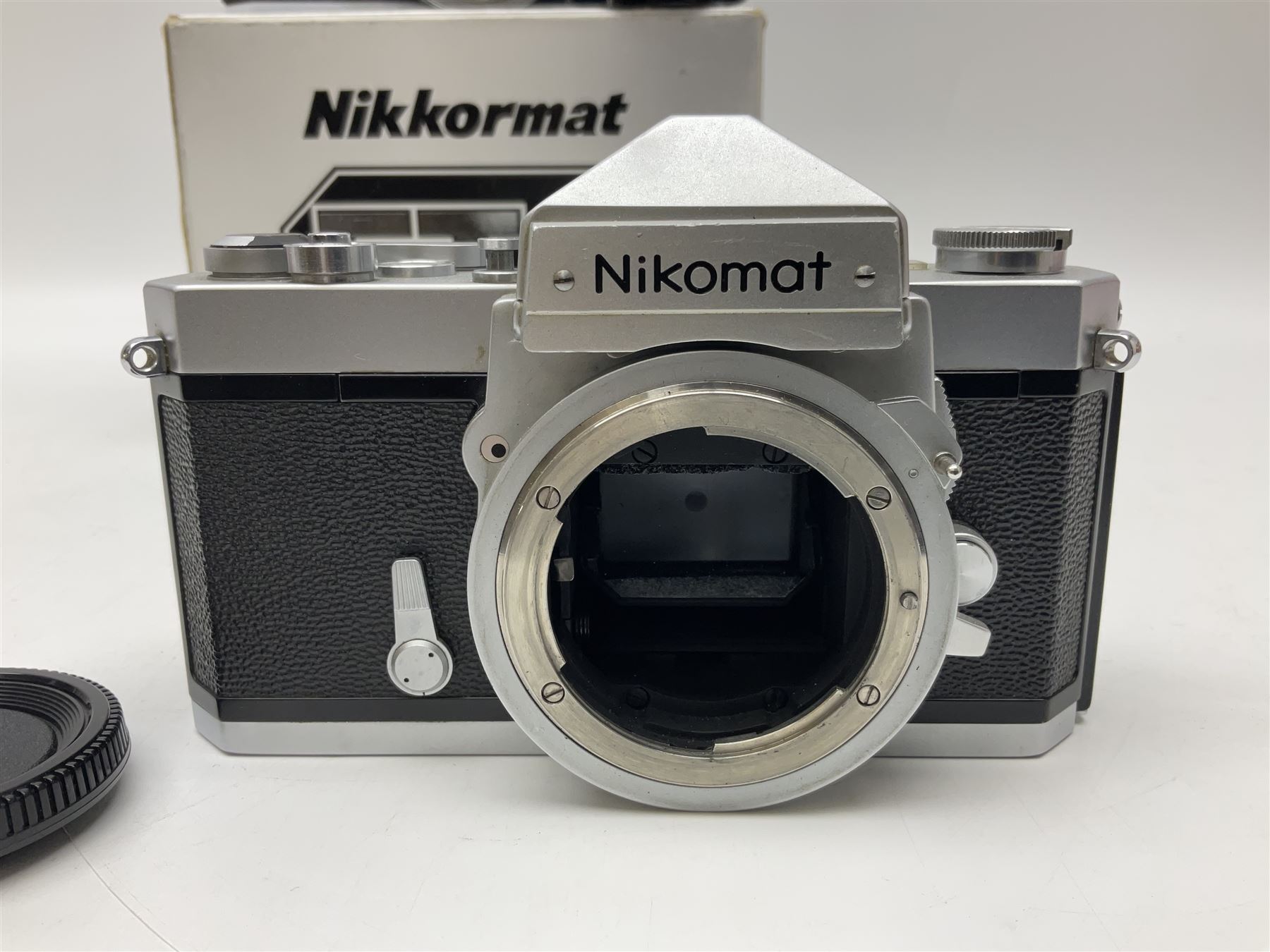 Nikkormat FT2 camera body, serial no. 5066813, in original packaging, together with Nikkormat EL camera body, serial no. 5577358, with Nikon Nikkor 50mm 1:1.8' lens no. 2143575, Nikkormat FT, serial no. 3968385, and Nikomat FT camera body, serial no. 4015491
