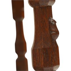 Mouseman - 1940's dark-honey oak rocking chair, high back with pierced double-lattice panel, over a beige-leather upholstered seat, shaped arm terminals above turned octagonal front-supports united by rocker base, with carved mouse signature, by the workshop of Robert Thompson of Kilburn