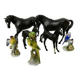 Four Beswick black matte horse figures, together with three bird figures, including Parakeet and Budgerigar by Royal Adderley