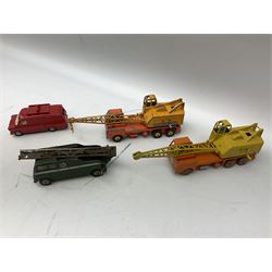 Dinky - thirteen unboxed and playworn die-cast commercial vehicles including two Supertoys 20-Ton Lorry-Mounted Cranes; Leyland Octopus Tanker; Fire Engine No.955; Extending Mast Vehicle No.969; two TV Roving Eye Vans No.968; three Ford Transit Vans; Brinks Armoured Car No.275; etc