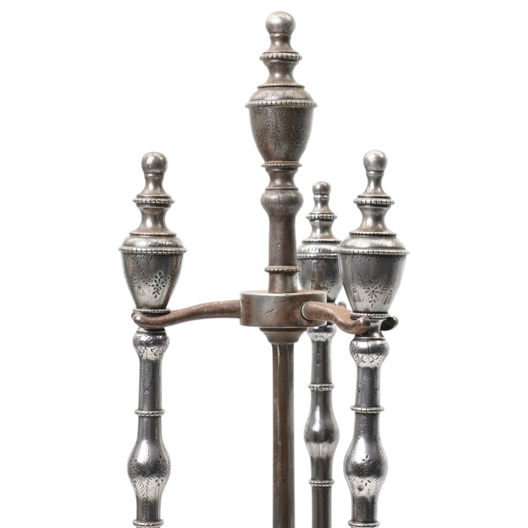 Two 19th century fireside companion sets, one four piece and one three piece, the stand and irons with etched foliate motifs, larger H74cm (2)
Provenance: Kirkham Hall