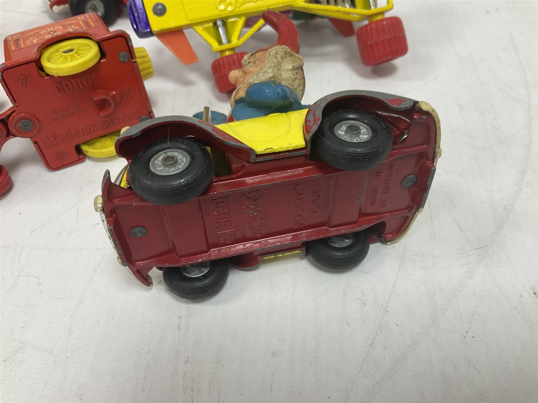 Corgi/Dinky - twelve unboxed and playworn TV/Film related die-cast models including Popeye Paddle Wagon; Dick Dastardly; Magic Roundabout; Muppets; Basil Brush; and Noddy (12)