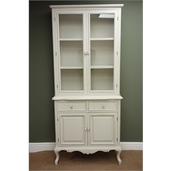  French style painted bookcase on cupboard, projecting cornice, two doors enclosing shelves above two drawers and two cupboard doors, cabriole legs, W88cm, H200cm, D40cm (MAO0503)  