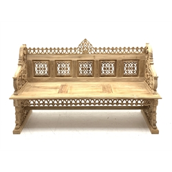 Heavily carved teak bench, panelled pierced back, profusely carved with foliate scrolls and flower heads, W168cm, H100cm, D59cm