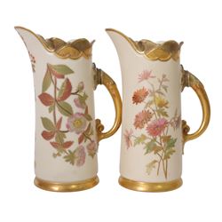 Royal Worcester blush ivory quatrelobe coral jug, decorated with floral sprigs shape 1507 together with two jugs with a shell moulded rim and decorated with flowers, shape 1229, all with puce marks beneath, quatrelobe jug H22cm 