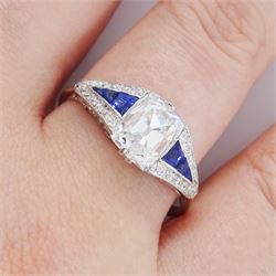 Platinum diamond and sapphire ring, the principal old cushion cut diamond of approx 1.50 carat, each side set with three graduating calibre cut sapphires and old cut diamond surround