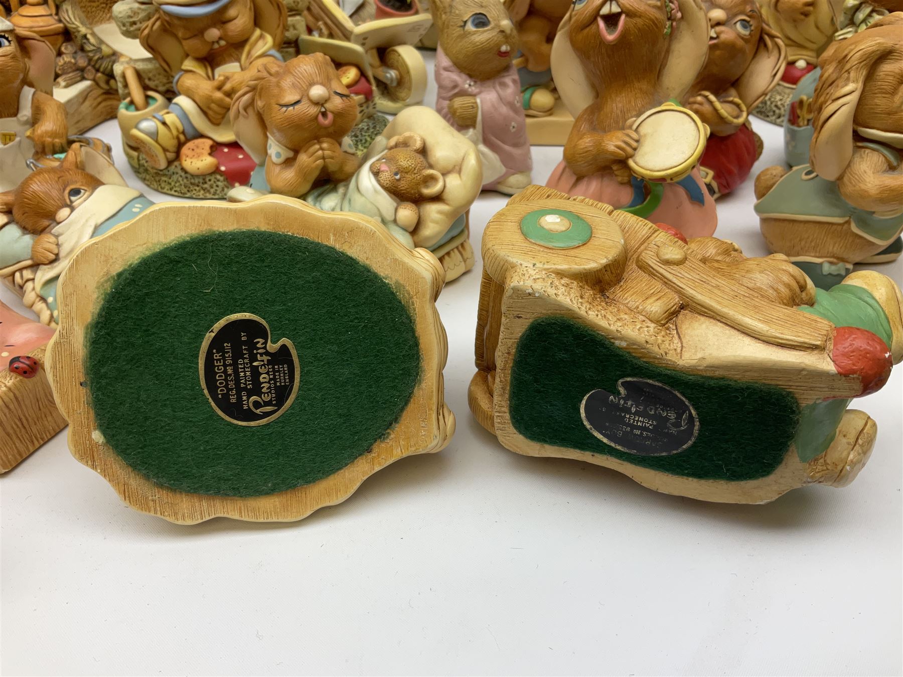 Extensive collection of Pendelfin rabbits and stands, to include Betsy Barge, Fruit Shop, Uncle Soames, Event Piece etc, many with original boxes 