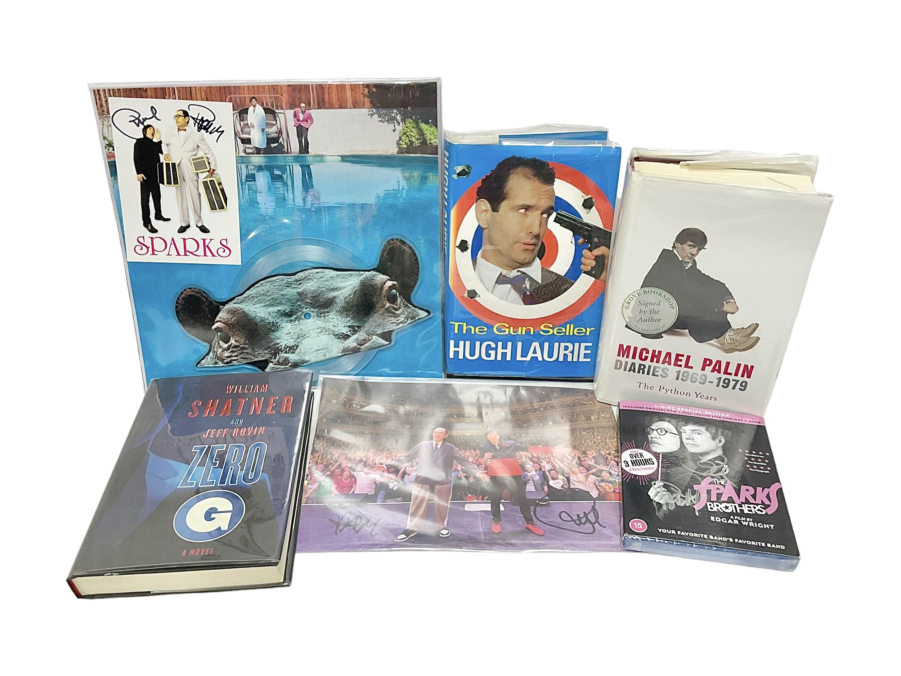 Signed books and ephemera, including Michael Palin Diaries 1969-1979, The Sparks Brothers, Hugh Laurie The Gun Slinger etc 