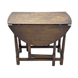 19th century oak gateleg table, the oval drop-leaf top formed of four planks, on turned column supports united by rectangular stretchers