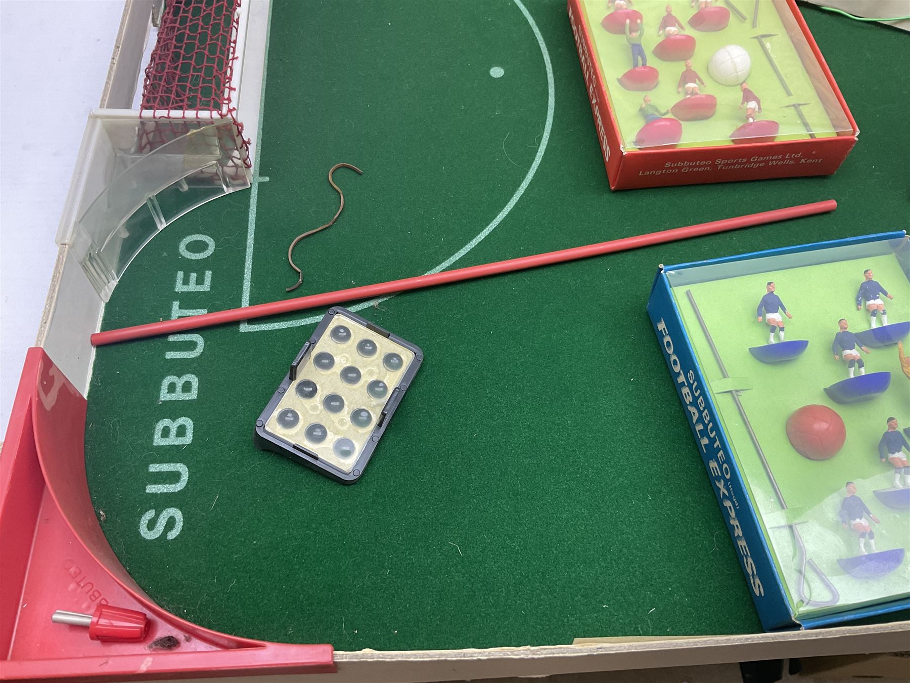 Subbuteo - three boxed sets comprising Football Express with two five-a-side teams and floodlighting; Continental with four teams and accessories; and International Edition Table Rugby with two teams; together with a Real Madrid 1974-75 League Champions pennant (4)