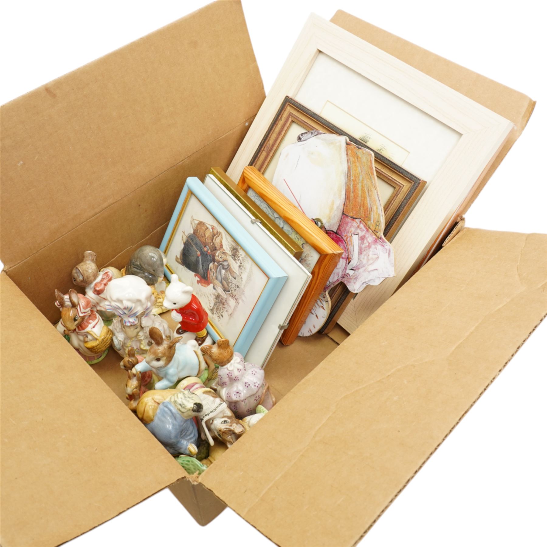 Collection of ten Beswick Beatrix Potter figures, brown back stamps, a Rupert figure and a number of Beatrix Potter prints