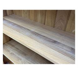 Contemporary light oak open bookcase, rectangular form with projecting top, fitted with five adjustable shelves, on a straight plinth base