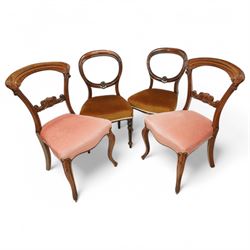A pair of Victorian walnut balloon back 