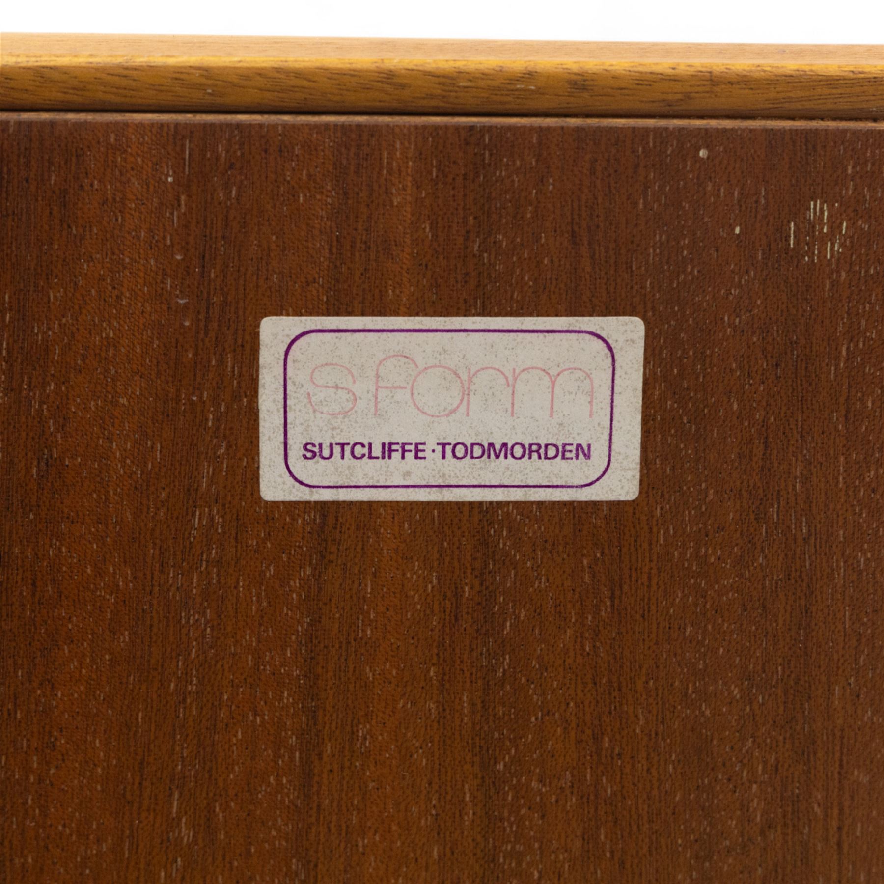 Sutcliffe of Todmorden - Mid 20th century teak highboard, ‘S-Form’ range, the upper section with glazed and panelled sliding doors above open shelving, over a base fitted with twin drawers and cupboards, all with moulded recessed handles, on shaped tapering supports, reflecting the sleek organic styling characteristic of 1960s British modern furniture design