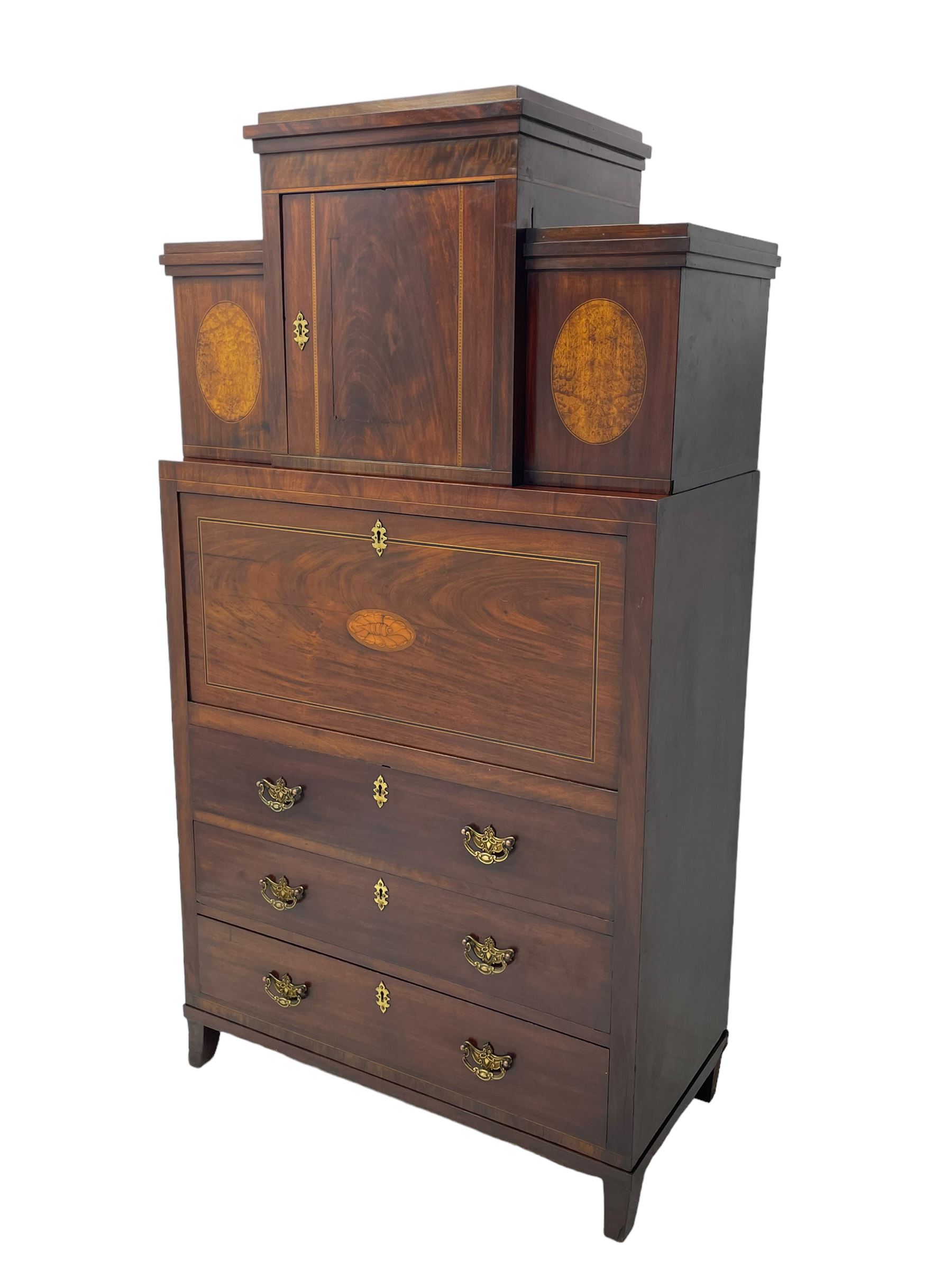 Early to mid-19th century figured mahogany Continental secrétaire à abattant, stepped top fitted with single cupboard, inlaid with oval figured amboyna panels, the fall front inlaid with shell motif enclosing a satinwood interior fitted with cupboard, drawers, and pigeon holes, three long drawers below, on square tapering feet