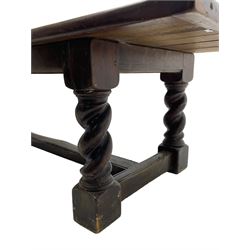 Large 19th century pine refectory dining table, cleated and pegged rectangular plank top over moulded skirt rails, on spiral turned and block supports joined by moulded H-shaped stretchers
