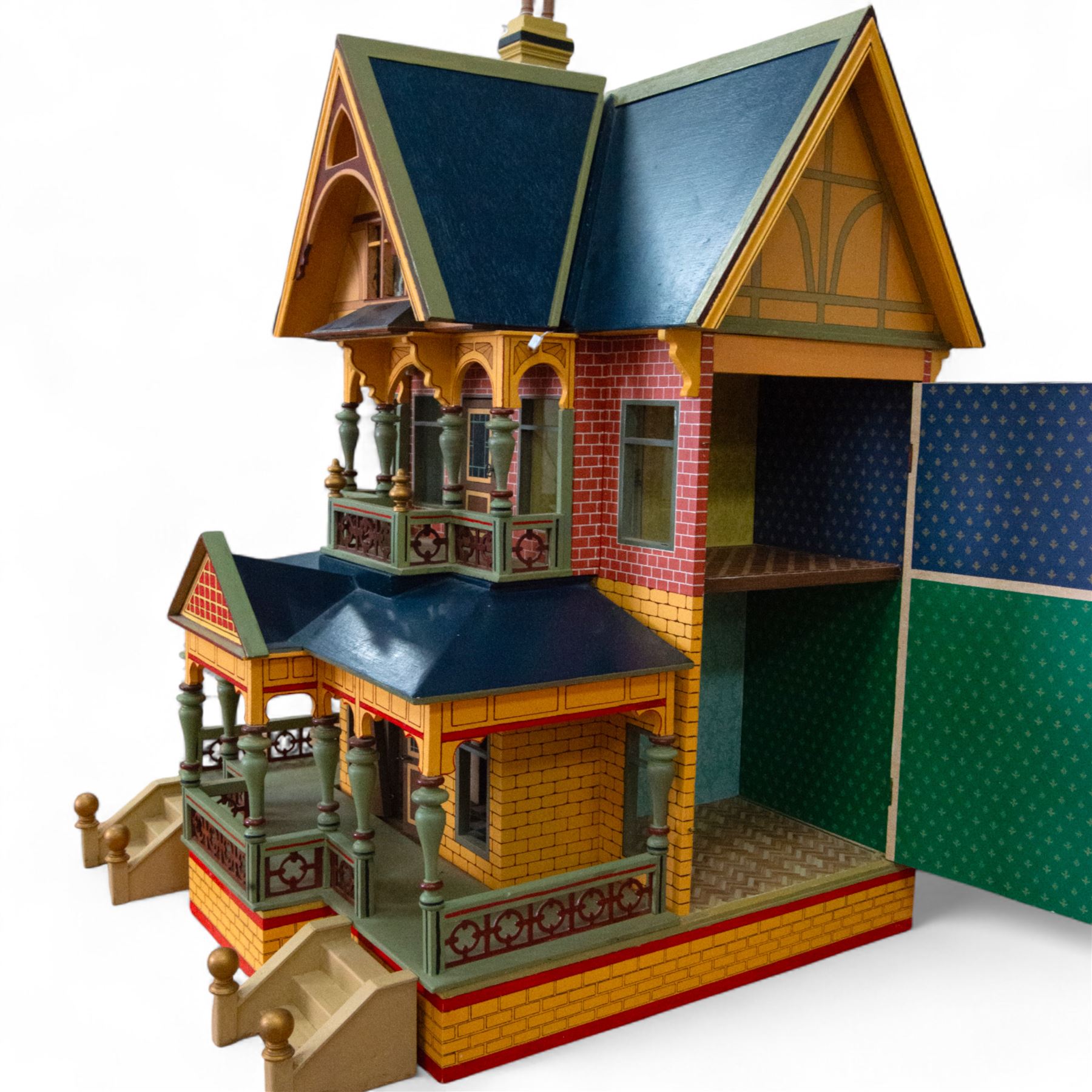 Moritz Gottschalk three storey wooden dolls house model 3589, with two side openings, with blue roof, painted exterior and wallpapered and painted interior, similar example featured in 'The Genius of Moritz Gottschalk' book, page 57, including chimney H100cm