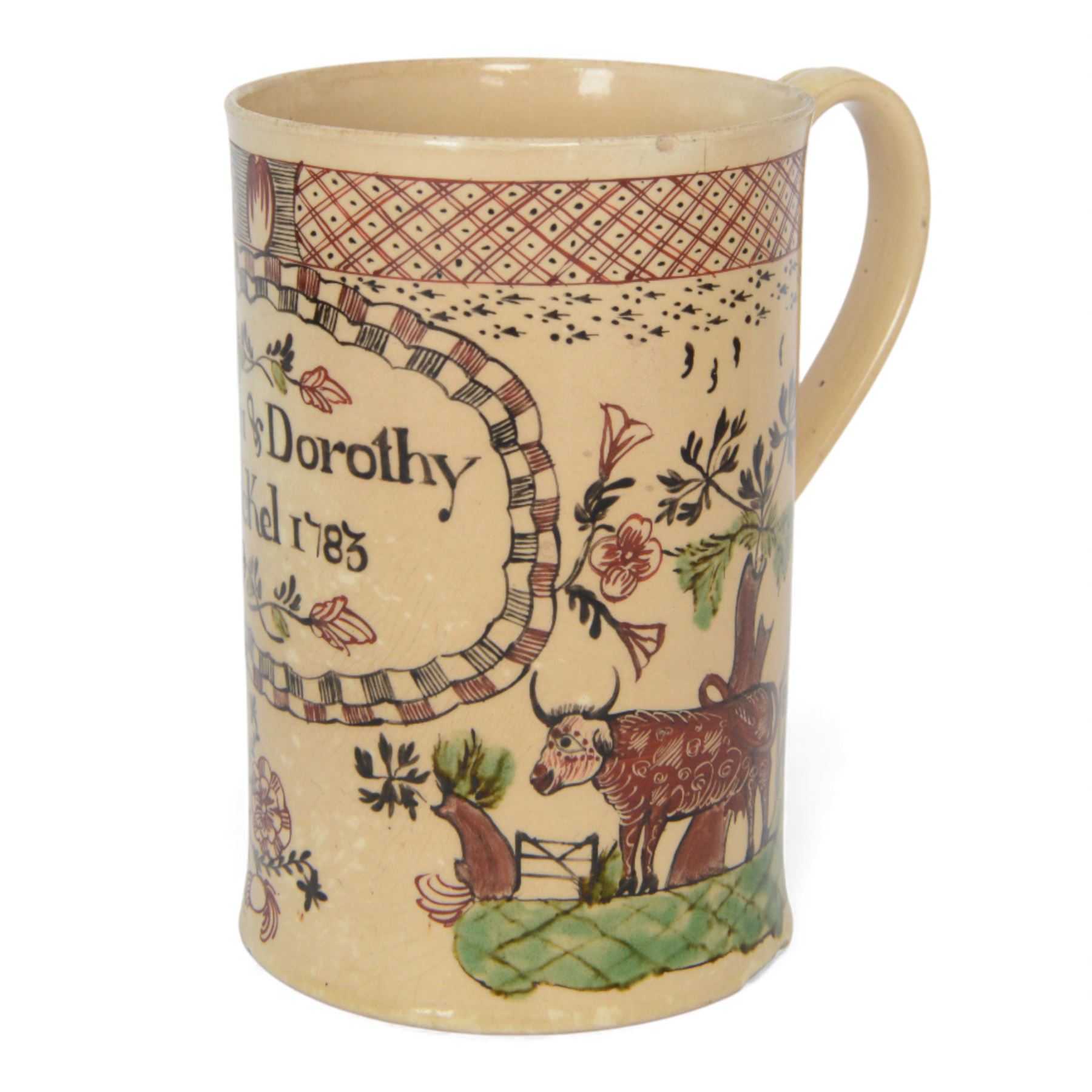 Late 18th century creamware documentary tankard, of cylindrical form with curbed handle, inscribed 'John & Dorothy Stockel 1783', above a floral spray and flanked by a seated female figure to one side, and bull and house to the other, H16.5cm