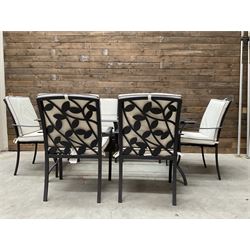 Metal framed garden table with glazed top (W170cm, D102cm, H71cm) and six armchairs with cushions 