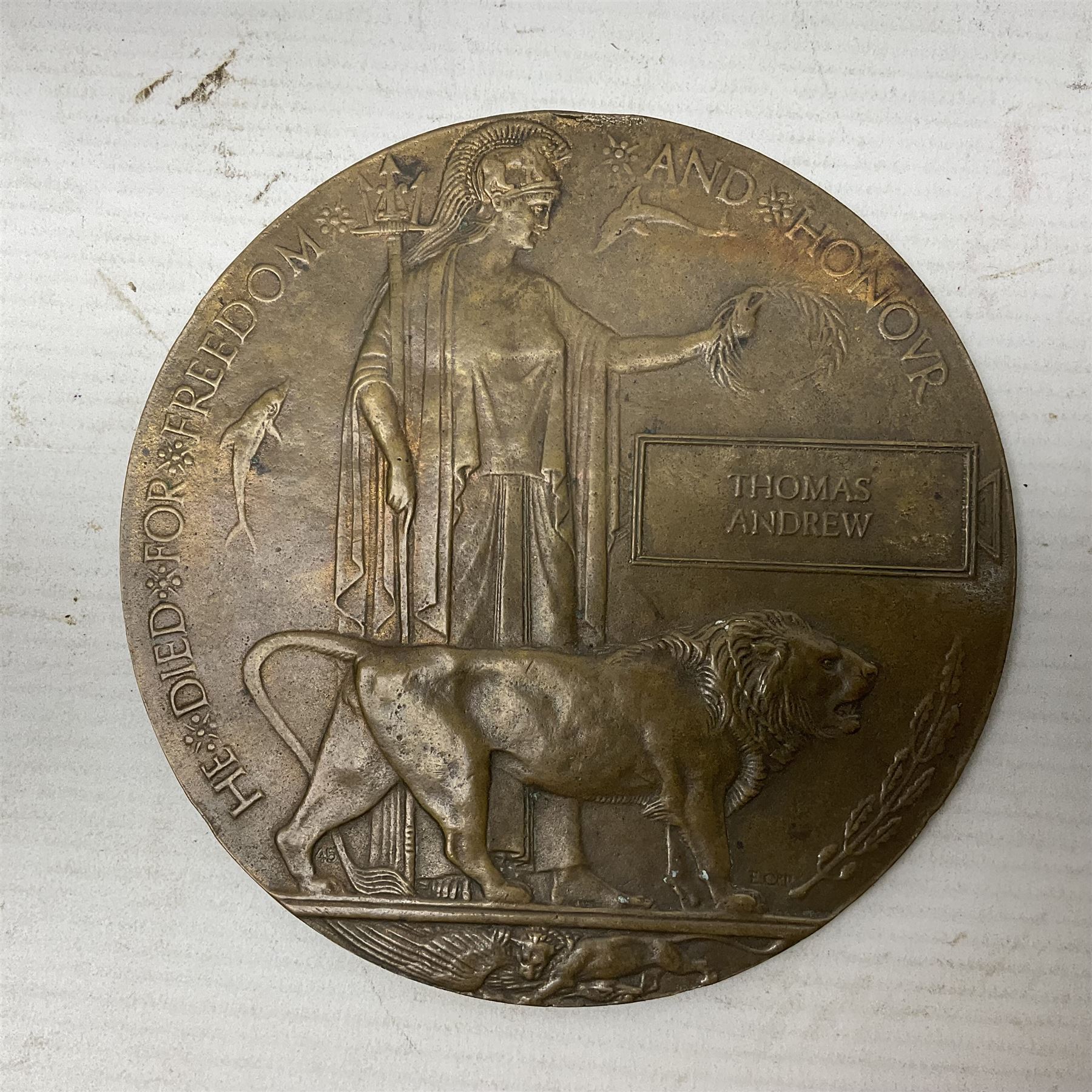 WWI group of three medals with bronze memorial plaque comprising 1914-15 Star, British War Medal and Victory Medal awarded to 16554 Pte. T. Andrew Linc. R. who died on 26th July 1916 whilst travelling to Vimy Ridge, polished and mounted for display in a frame; together with small archive of research material and two WWII V.E. Day Presentation Certificates from the people of Holbeach in Lincolnshire