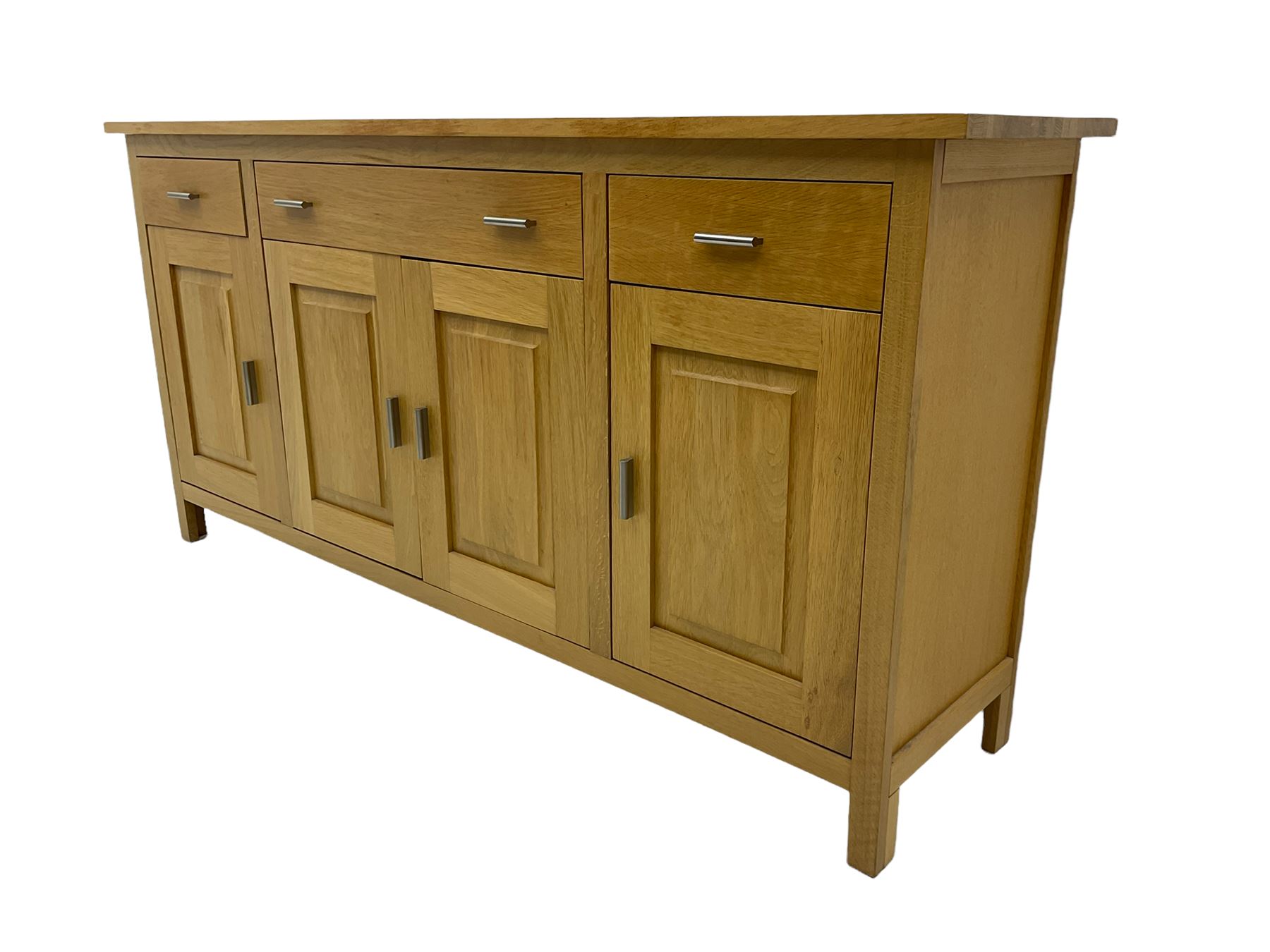 G-Plan - light oak sideboard, fitted with three drawers and four panelled cupboards