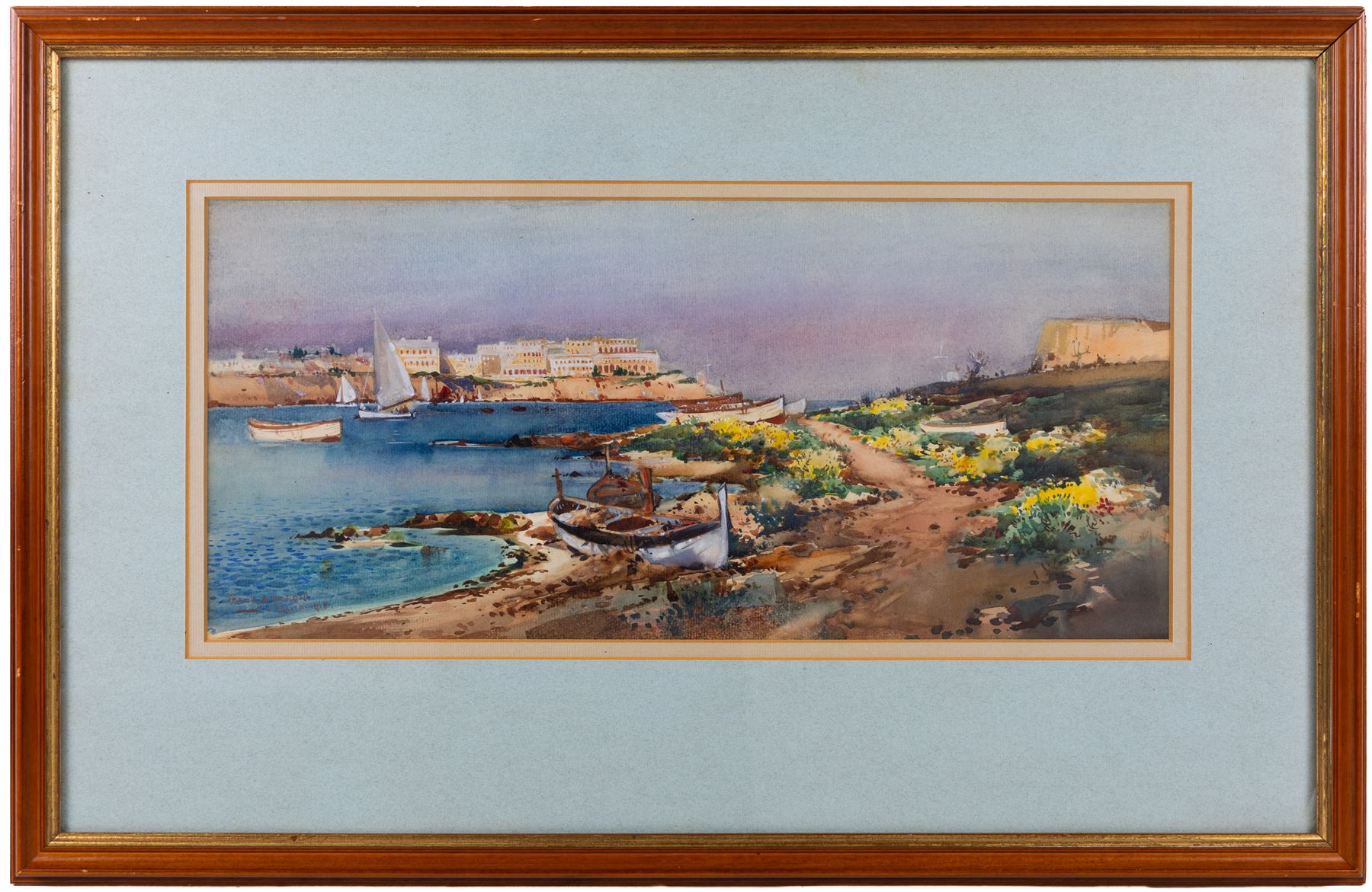 Frank Henry Mason (Staithes Group 1875-1965): 'Sliema Creek - Malta', watercolour signed titled and dated 1918, further titled on exhibition label verso 22cm x 49cm 
Notes: Mason joined the Royal Naval Volunteer Reserve at the onset of the Great War, rising to command a flotilla of Motor Launches. His postings included the East Coast of Britain but also the Suez Canal area. He visited Malta for the first time on his return journey from Egypt to England in the summer of 1916. After serving as a Dazzle Officer during 1918, he was then appointed as a War Artist at the end of the War and returned to Malta to prepare a large body of work now in the Imperial War Museum. This watercolour is dated 1918 and is one of a small group Mason painted during 1918 and 1919, independently of the IWM commission.