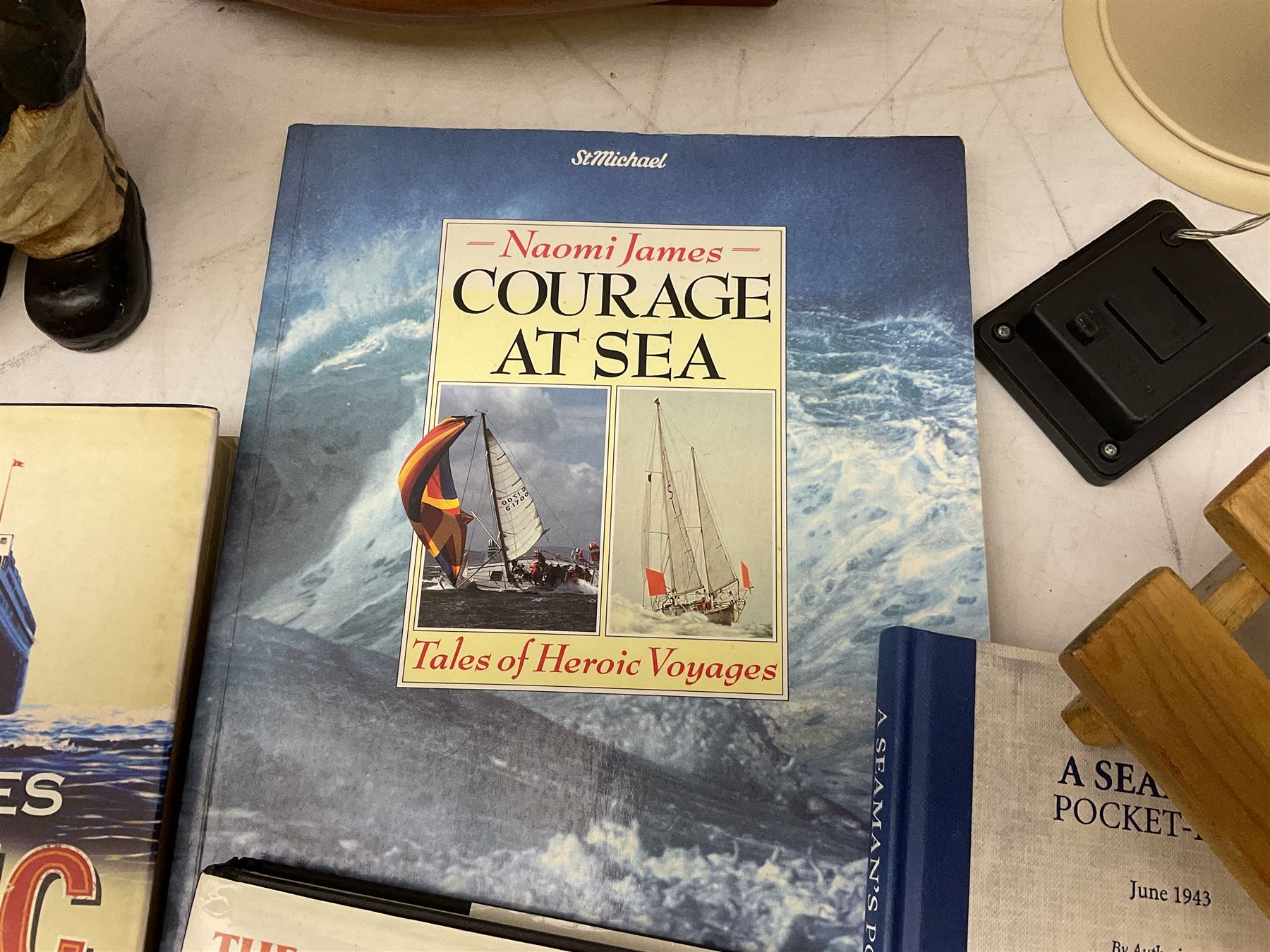 Nautical themed decorative items, to include Titanic book ends, model boat, books, lighthouse lamp etc in one box