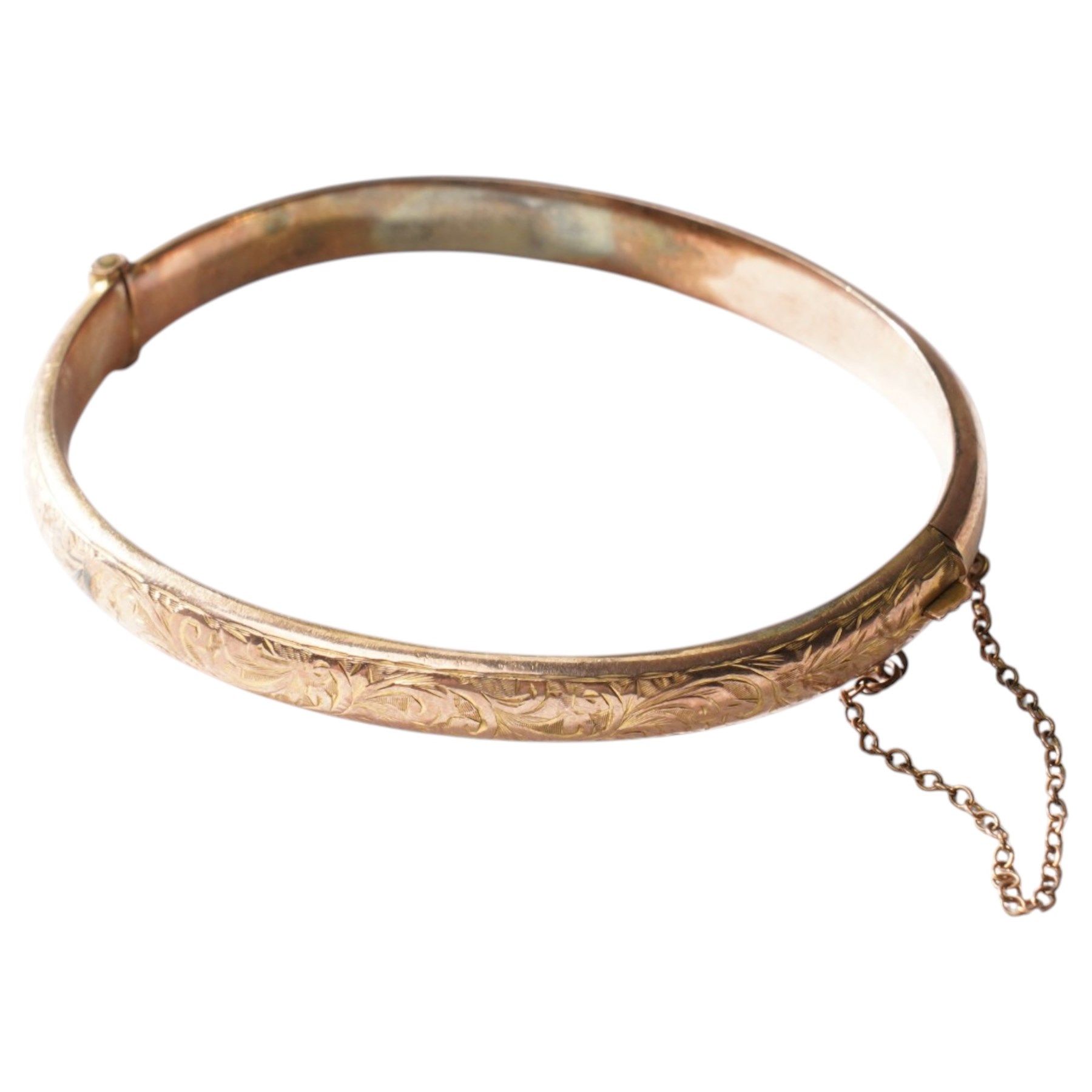 9ct gold hinged bangle with engraved decoration 