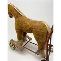 Pedigree push along plush covered horse 1950s-60s with red tubular metal framework and beech foot rests H25