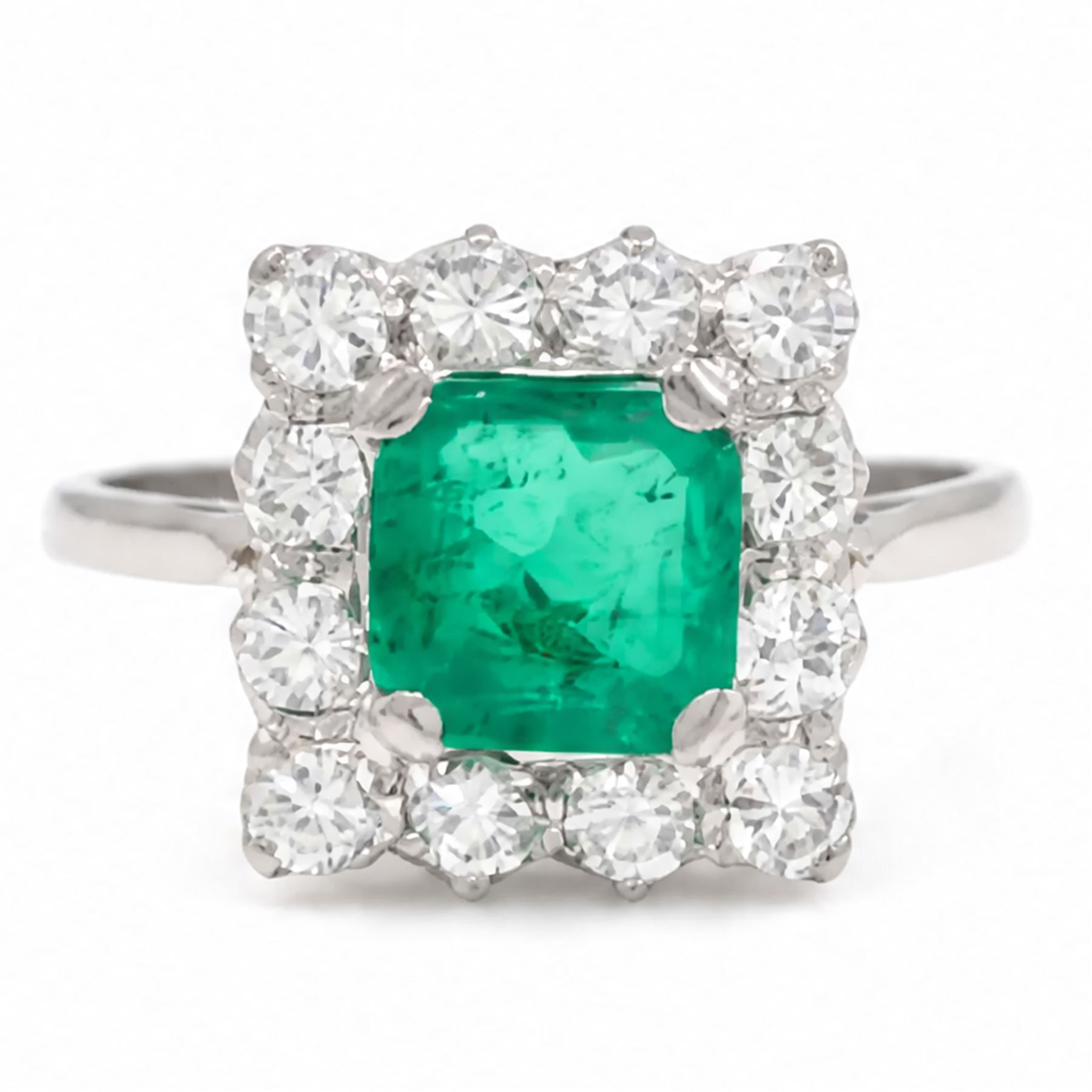 18ct white and yellow gold emerald and diamond cluster ring, single octagonal cut emerald of approx 1.55 carat, surrounded by twelve round brilliant cut diamonds, total diamond weight approx 0.95 carat