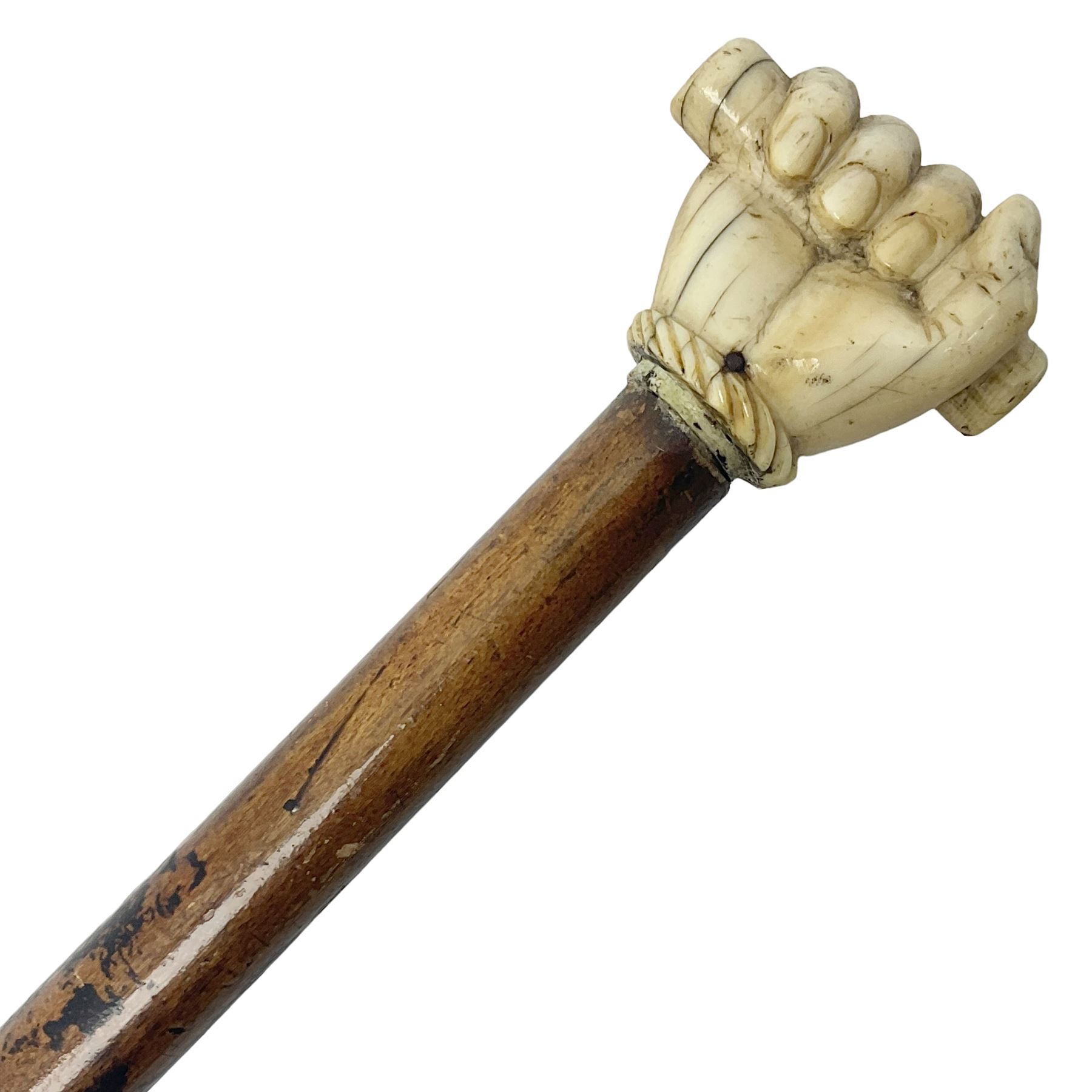 19th century malacca walking cane with scrimshaw handled in the form of a clenched fist holding a scroll, H86cm 