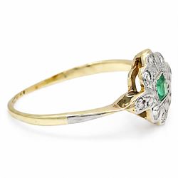 Early 20th century gold and platinum emerald and diamond panel ring, single rectangular cut emerald, surrounded by eight single cut diamonds, stamped 18ct & PT