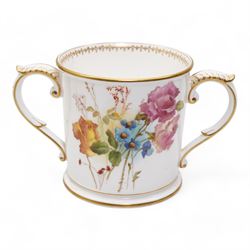 Early 20th century Royal Worcester loving cup, circa 1906, painted with a view of the River Severn and flowers to the reverse, H13cm, Grainger & Co. Worcester twin handled vase, the oval body painted in the Aesthetic style with ferns and grasses in gilt, against a cobalt blue ground, with scrolled handles and quatrefoil foot, H17cm (2)
