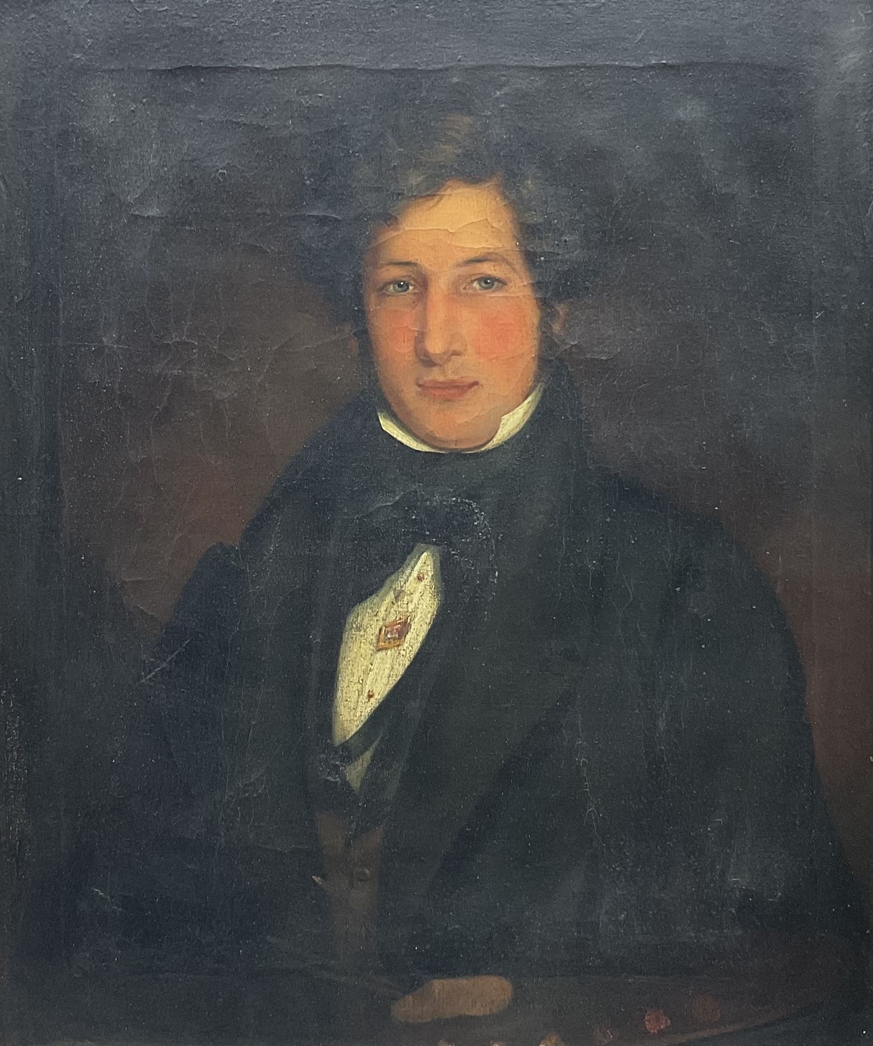 English School (Early 19th century): Half Length Portrait of a Regency Period Gentleman, oil on canvas unsigned, housed in moulded gilt frame with cartouche corners 75cm x 62cm 