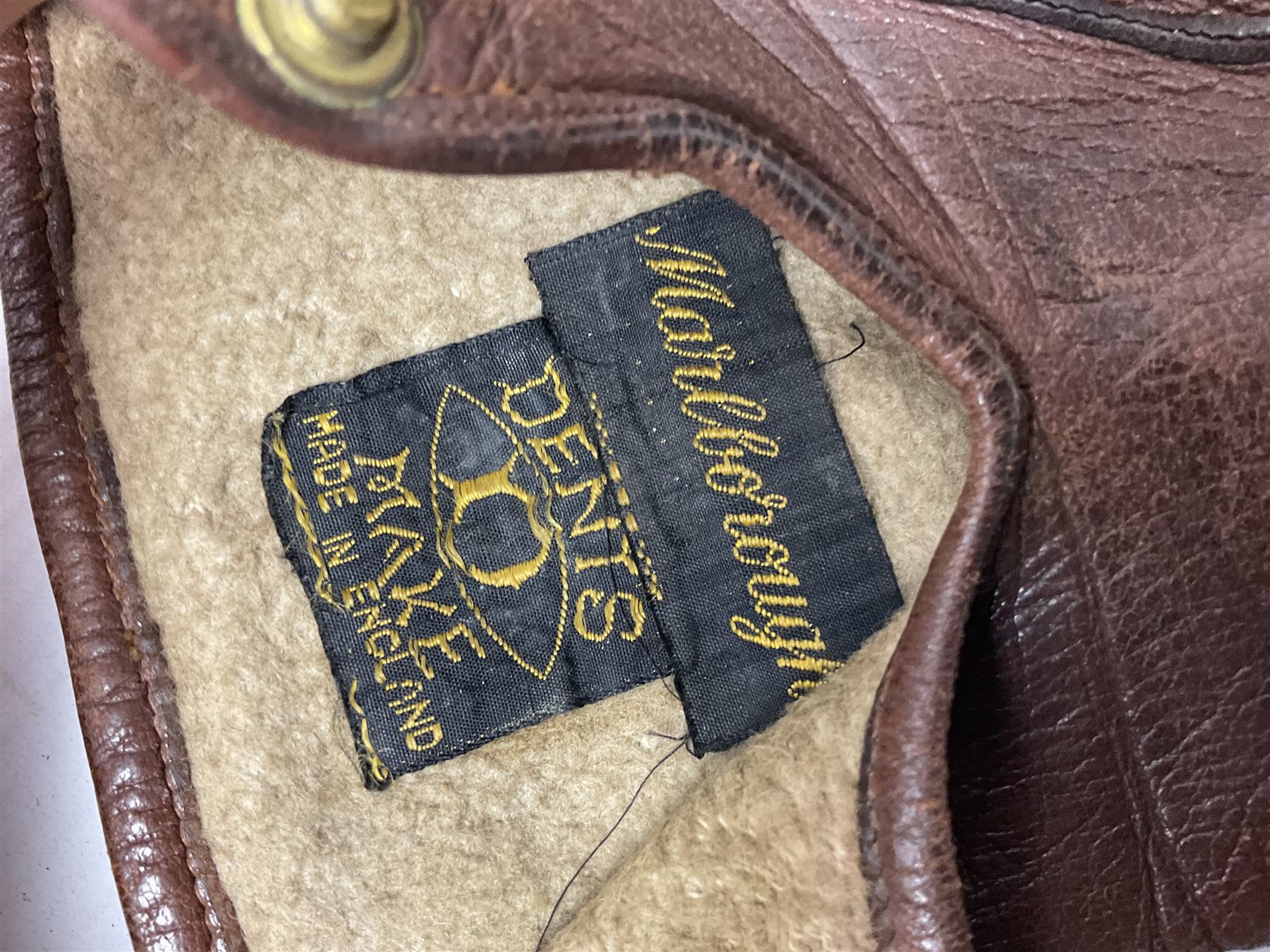 British Army General Staff officer's peaked cap by Herbert Johnson London in Moss Bros. delivery box; two officer's Sam Browne leather belts; leather pistol holster and sword hanger; pair of leather gloves and pair of spurs