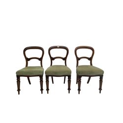 Set three late 19th century mahogany dining chairs, centre back rail carved with scrollwork, raised on turned and reeded supports