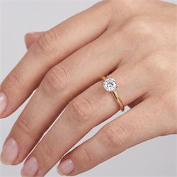 14ct gold diamond ring, four claw set with a single round brilliant cut diamond of 0.61 carat, stamped