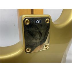 Fender Stratocaster 50th Anniversary 2004 metallic gold electric guitar; serial no.MZ4116369; L98cm; in Spider fitted case with owners manual and other paperwork, strap and belt buckle etc